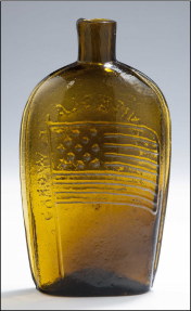 a Stoddard golden amber pint size flag flask with 13 stars, realized $14,400.